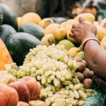 woman-india-market-buys-fruits-vegetables-bracelets-184836780