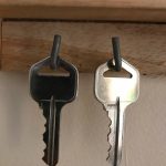 This are 2 sliver keys hanging next to each other