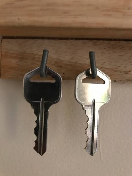 This are 2 sliver keys hanging next to each other