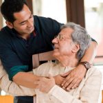 Man spending time with his father at home