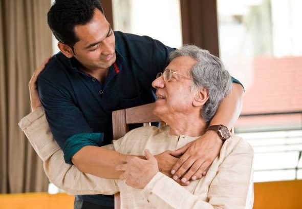 Man spending time with his father at home